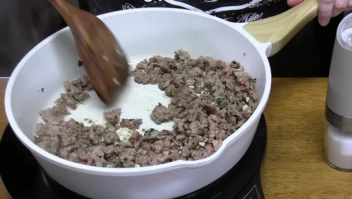 Drain any excess grease from the sausage.
