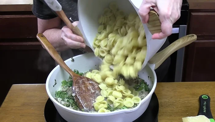 Add the drained pasta to the skillet and toss to coat.