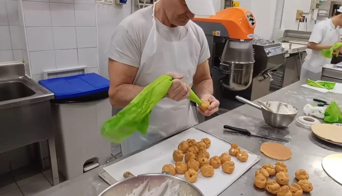 Fill the profiteroles with the whipped cream. Ensure they are filled adequately.