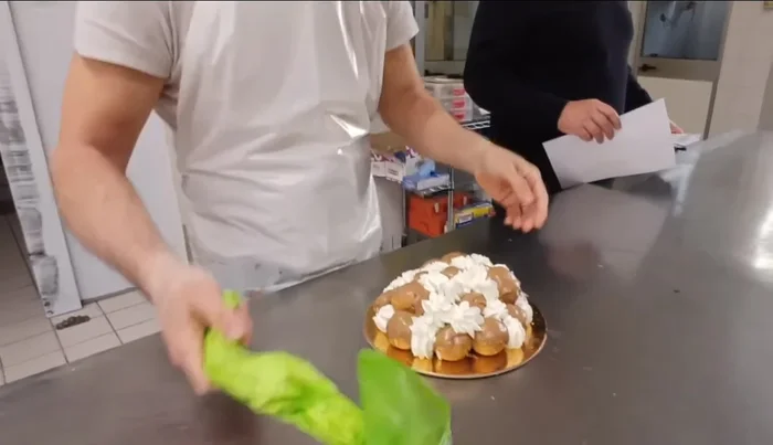 Arrange the filled profiteroles into your desired design. The video shows simple and elegant arrangements.
