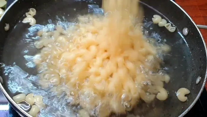 Boil 3 cups of water with 2 cups of pasta, 2 teaspoons of salt, and 1 tablespoon of oil for 8-10 minutes until pasta is cooked but not overcooked.