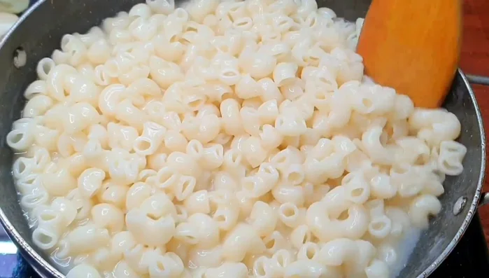 Rinse the cooked pasta with cold water to prevent sticking and maintain creamy texture.