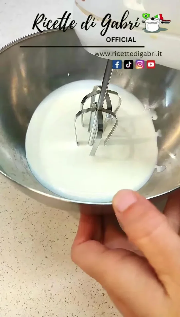 In a cold bowl, whip cold vegetable cream until stiff peaks form. [93.04]