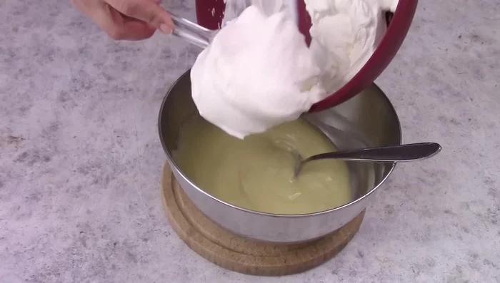 Once the cream is cold, gently fold in the whipped cream.
