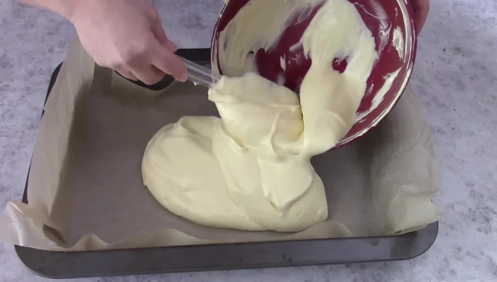 Spread the batter in a baking tray lined with baking paper and bake at 160°C until cooked.