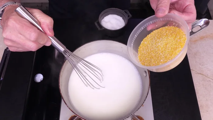 Add salt and polenta gradually, stirring constantly to prevent lumps.