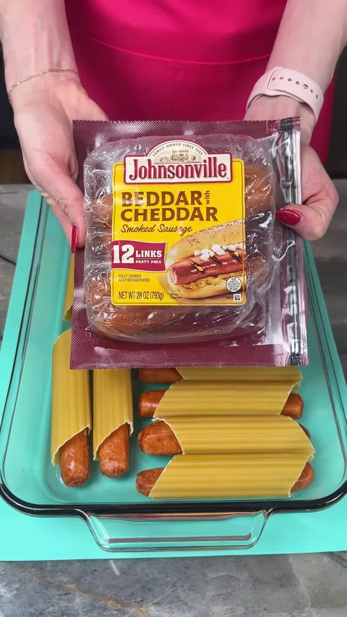 Place Johnsonville Better Cheddar Smoked Sausages into uncooked manicotti noodles.