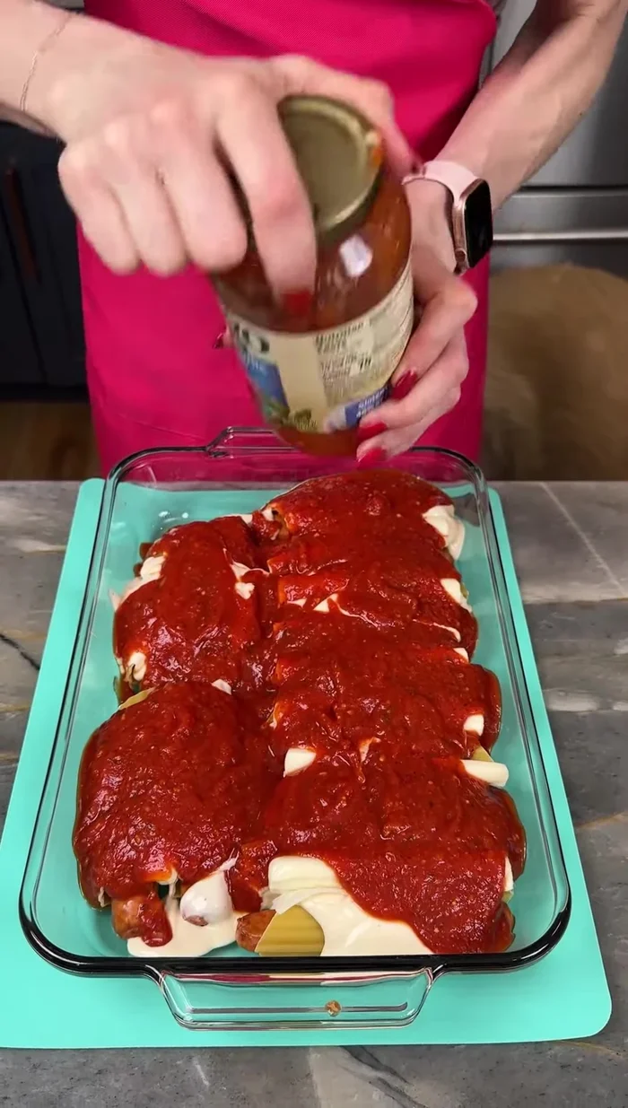Drizzle water over the manicotti to help cook the noodles.