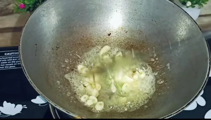 Add a little butter to the same pan. Add crushed garlic and fry lightly.