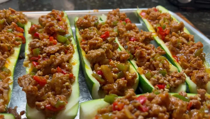 Bake the zucchini boats in the oven at [temperature not specified in transcript] for 20 minutes.