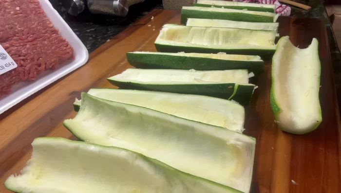 Salt the zucchini boats generously and let them sit for about 15 minutes to draw out moisture. Afterward, thoroughly dry them with paper towels.