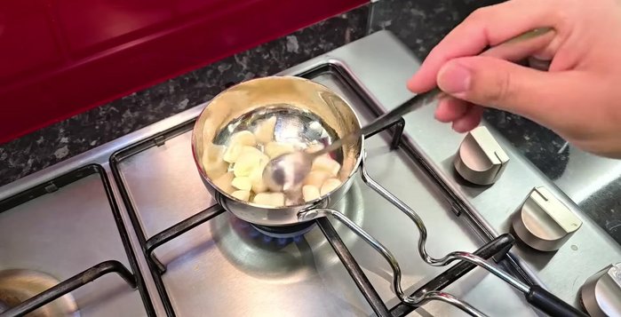 Prepare garlic butter: Sauté garlic cloves in olive oil until golden brown. Mix with softened butter, fresh coriander, and dry herbs.