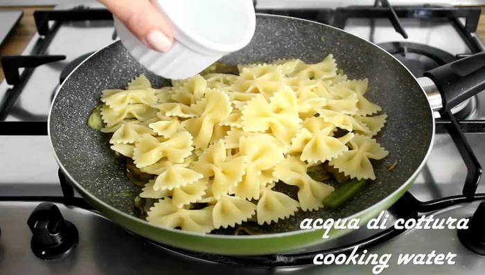 Combine pasta and artichokes: Drain pasta and add to the pan with artichokes and a little cooking water. Stir.