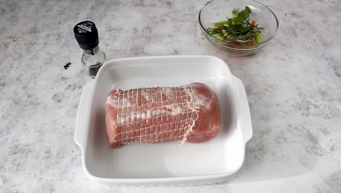 Marinate pork loin: Place pork loin in a container with red wine, rosemary, bay leaves, onion, carrot, celery, garlic, and pepper. Marinate for at least 3 hours.
