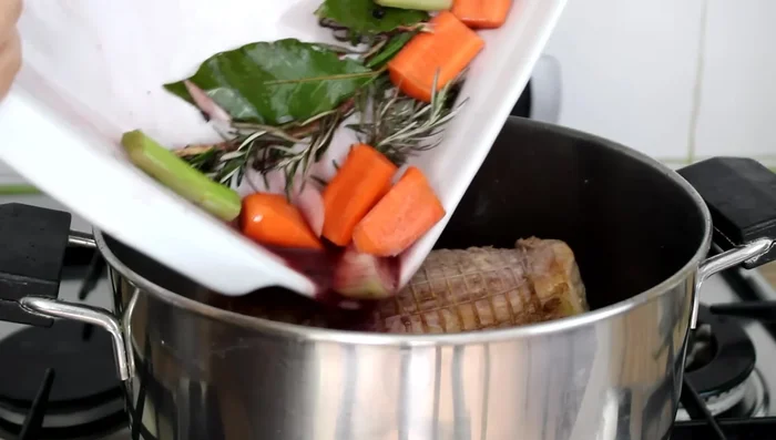 Cook the pork loin: Add the marinade to the pan. Cook for 60-70 minutes, covered, turning halfway through.