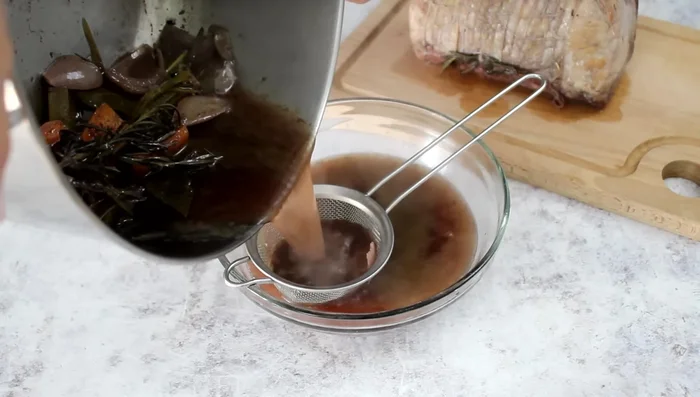 Make the sauce: Strain cooking juices from the pork, remove herbs. Blend the remaining vegetables and juices. Thicken with cornstarch.