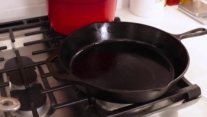 Heat your skillet and bring a pot of water to a boil. Add 1/4 cup of olive oil to the skillet.
