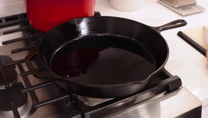 Add roughly chopped garlic to the heated olive oil. Be careful not to burn the garlic.