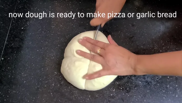 Divide the dough into portions and shape them into balls or desired shapes for pizza, garlic bread, or garlic balls.