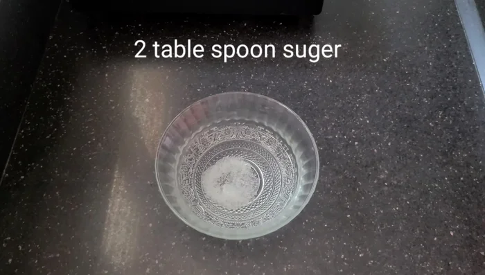 In a bowl, combine lukewarm water, sugar, and yeast. Let it sit for 15 minutes until the yeast ferments.