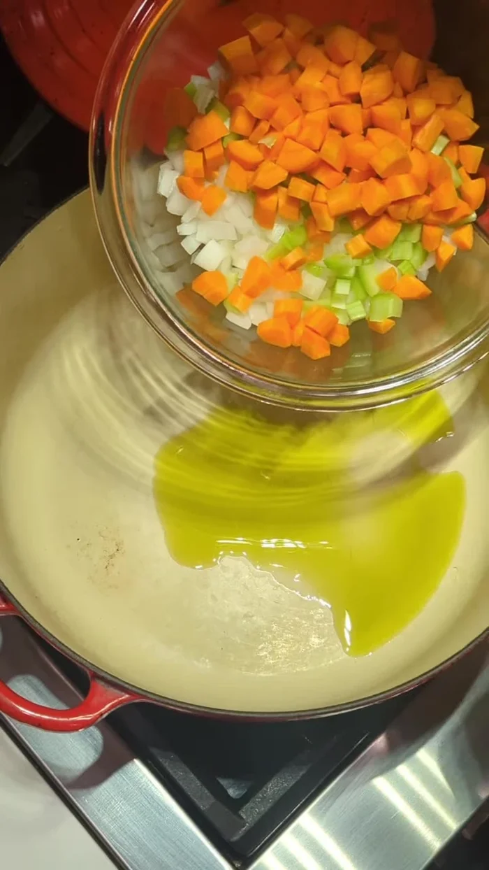 Add 1 diced onion, 1 stalk of celery, and 2 small diced carrots. Season with salt and pepper. Cook until softened.