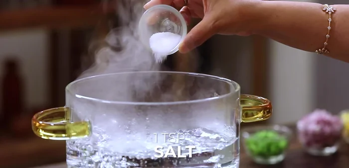 Cook pasta shells until about 90% done in boiling water with 1 teaspoon of salt.