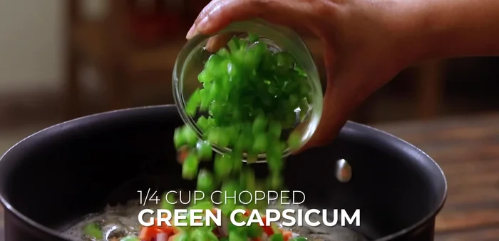 Add 1 cup of sweet corn and season with 1/2 teaspoon pepper, 1 teaspoon Italian seasoning, and 1 teaspoon chili flakes.