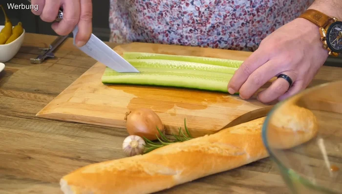 Prepare the cucumber by lightly peeling some parts for better aesthetics.