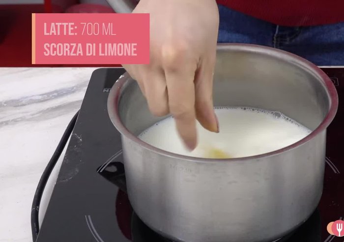 Heat 700 ml of milk with lemon zest.