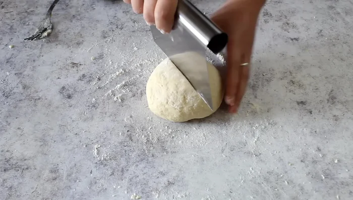Divide the dough into four equal parts.