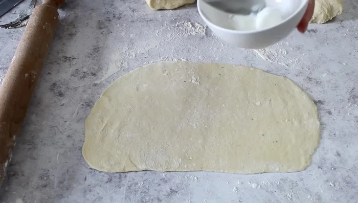Spread the remaining lard over each sheet.