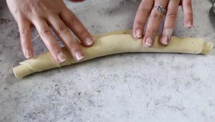 Roll the lard into the dough to create swirls.