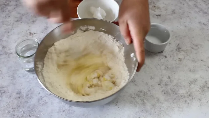 Incorporate remaining lard, salt, and pepper into the dough until smooth.