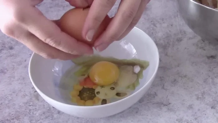 Add eggs to the dough, mixing until fully incorporated.