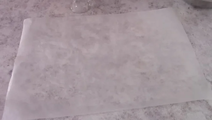 Pipe the sho pasta dough onto baking paper, forming circles.