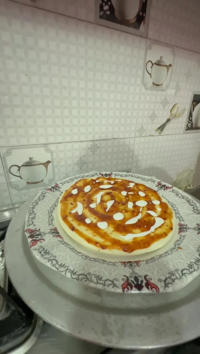 Add a layer of mammis topping.