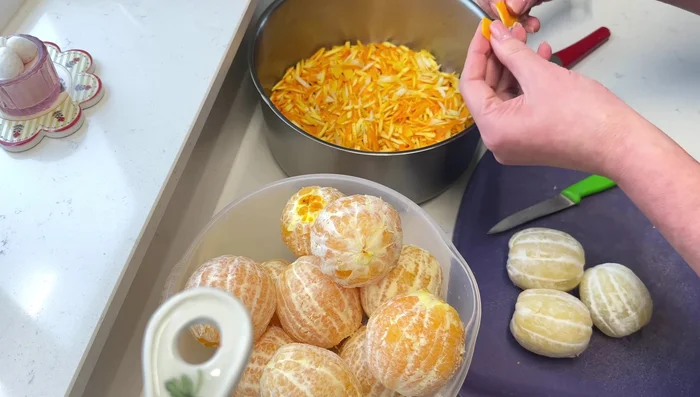 While the zest boils, cut the oranges and lemons into pieces, removing seeds (152).