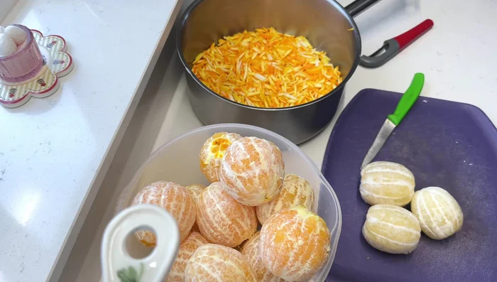 Add the orange and lemon pulp to the boiled zest along with the initial 300ml of water (231.439).