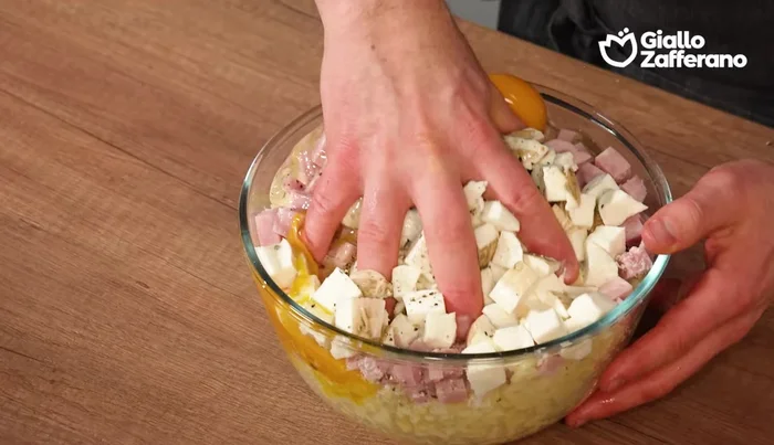 Add eggs to the mashed potato mixture and knead until well combined. Adjust consistency with more cheese (if too soft) or milk (if too dry).