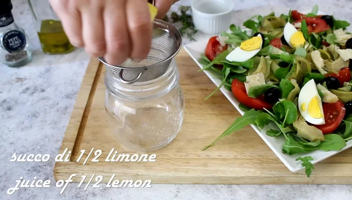 Make the salad dressing: Emulsify lemon juice, olive oil, salt, pepper, thyme, and oregano in a jar.