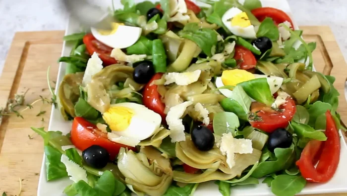 Dress the salad and serve.