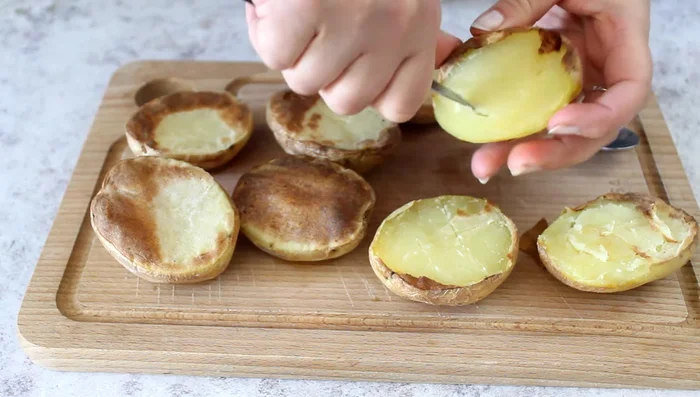 Lightly mash the scooped potato flesh.