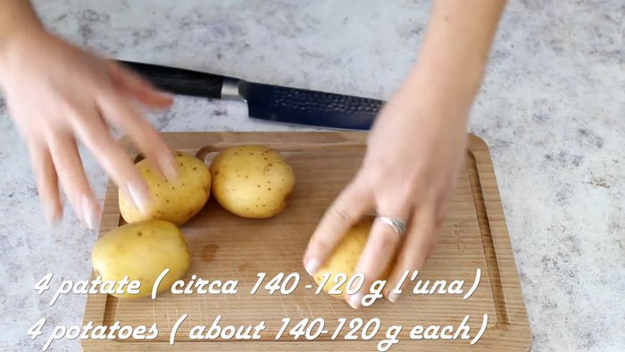 Wash and scrub four medium-sized potatoes of similar size.