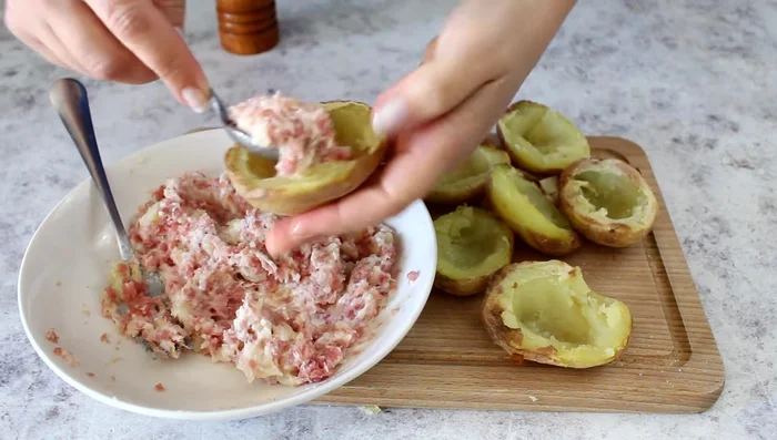 Fill the potato shells with the mixture.