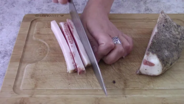 Cook bacon in a pan (no oil needed, bacon fat will melt). Cook until golden brown. Remove and set aside, leaving bacon fat in the pan.