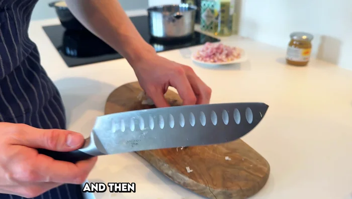Squeeze 3 garlic cloves to remove the skin.