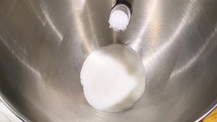 In a large bowl, combine yeast, salt, sugar, and eggs. Whisk together.
