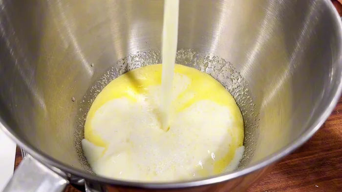 Add 2 cups of flour. Attach a dough hook to a stand mixer and combine on medium speed until smooth (about 2 minutes).