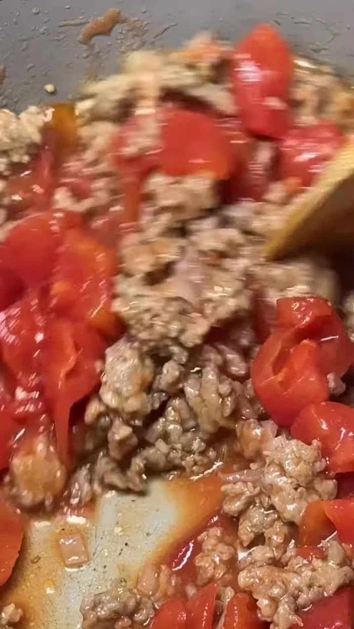 Brown Italian sausage in a pan.