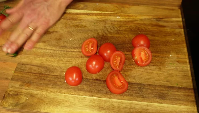 Add sliced tomatoes.